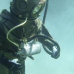 Diving Gear - Person in Green Scuba Diving Suit