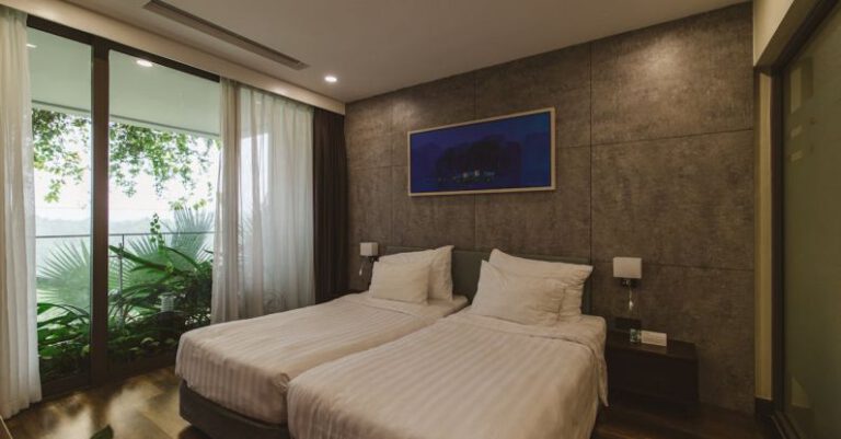 Seagrass Beds - A bedroom with two beds and a large window