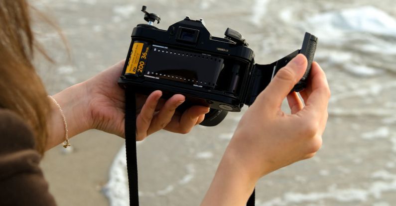 Open Ocean - Woman Holding Opened Camera