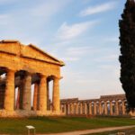 Archaeologists - The ancient greek temple of peleus in the background