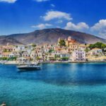 Mediterranean - White and Black Boat Sailing in Body of Water