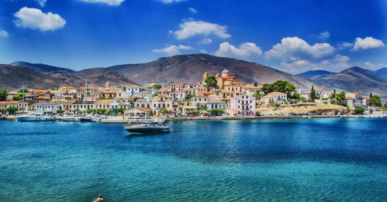 Mediterranean - White and Black Boat Sailing in Body of Water