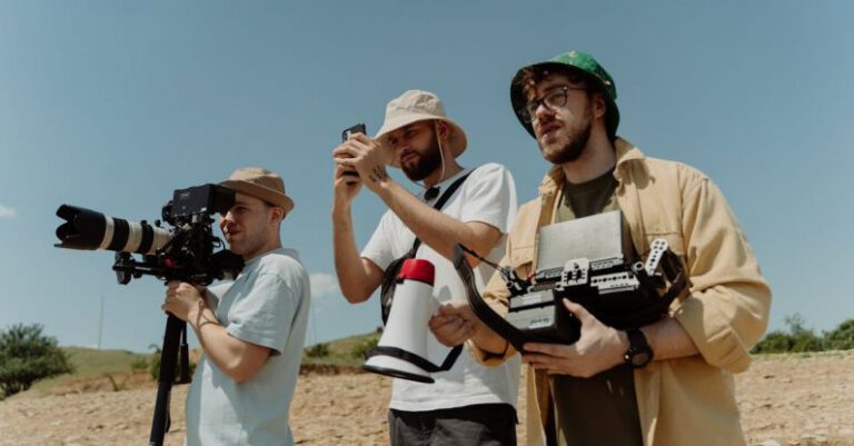 Technologies - A Low Angle Shot of Bearded Men Shooting a Film while Wearing Bucket Hats